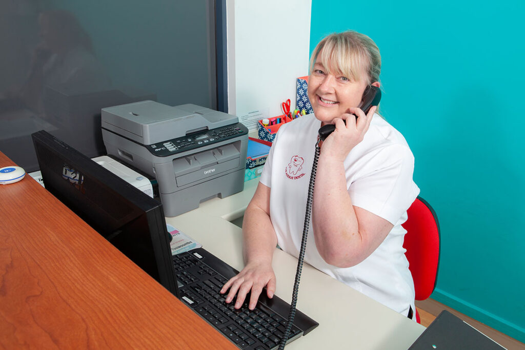 Jacki at front desk of The Avenue Dental Clinic
